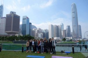 Tamar Park yoga with the Hong Kong skyline