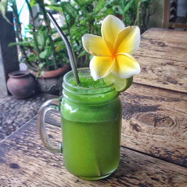 Juice and frangipani in Amed, Bali, Indonesia