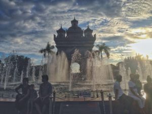 Patuxai and fountains at sunsets in Vietiane, Laos
