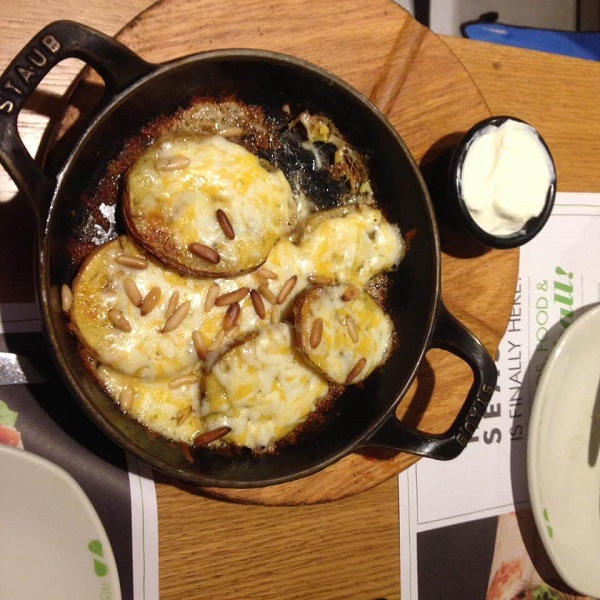 Qatari dish of potatoes with cheese and pine nuts