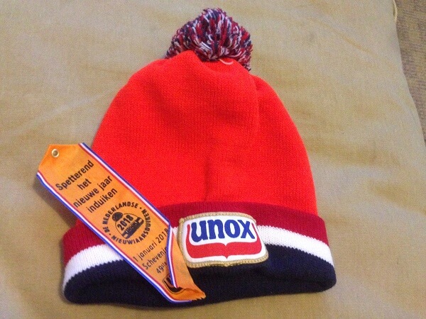 Orange Unox hat and ribbon from Nieuwjaarsduik Scheveningen