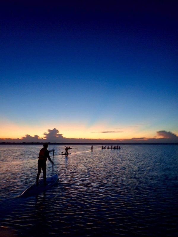 Standup paddleboarding at sunrise in Bacalar