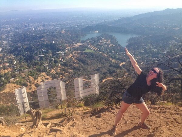 Usain Bolt pose at the top of the Hollywood Sign hike in Los Angeles, California